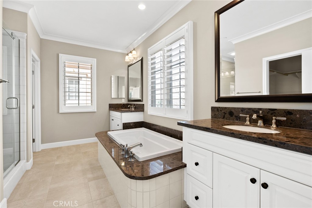 98 Cipresso Irvine, CA 92618 - Photo 21 of 59 a spacious bathroom with sinks mirror and double