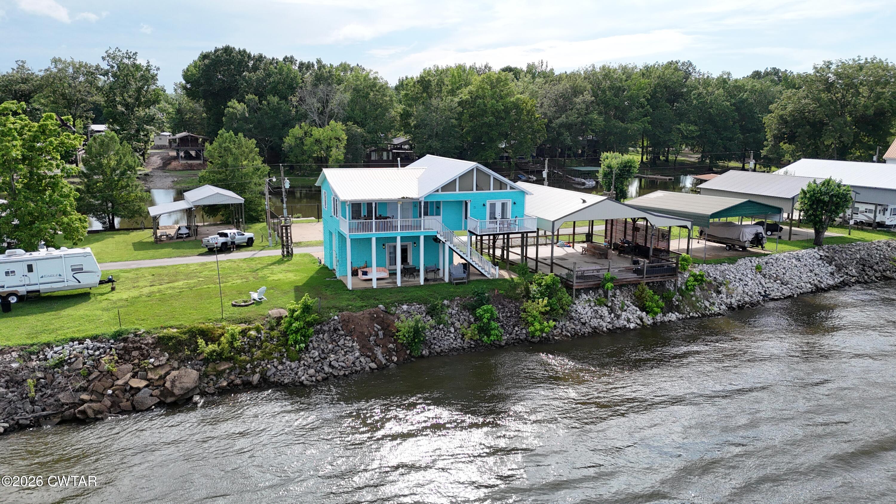404 Lagoon Lane Decaturville, TN 38329 - Photo 1 of 23 DJI_20260612181546_0438_D