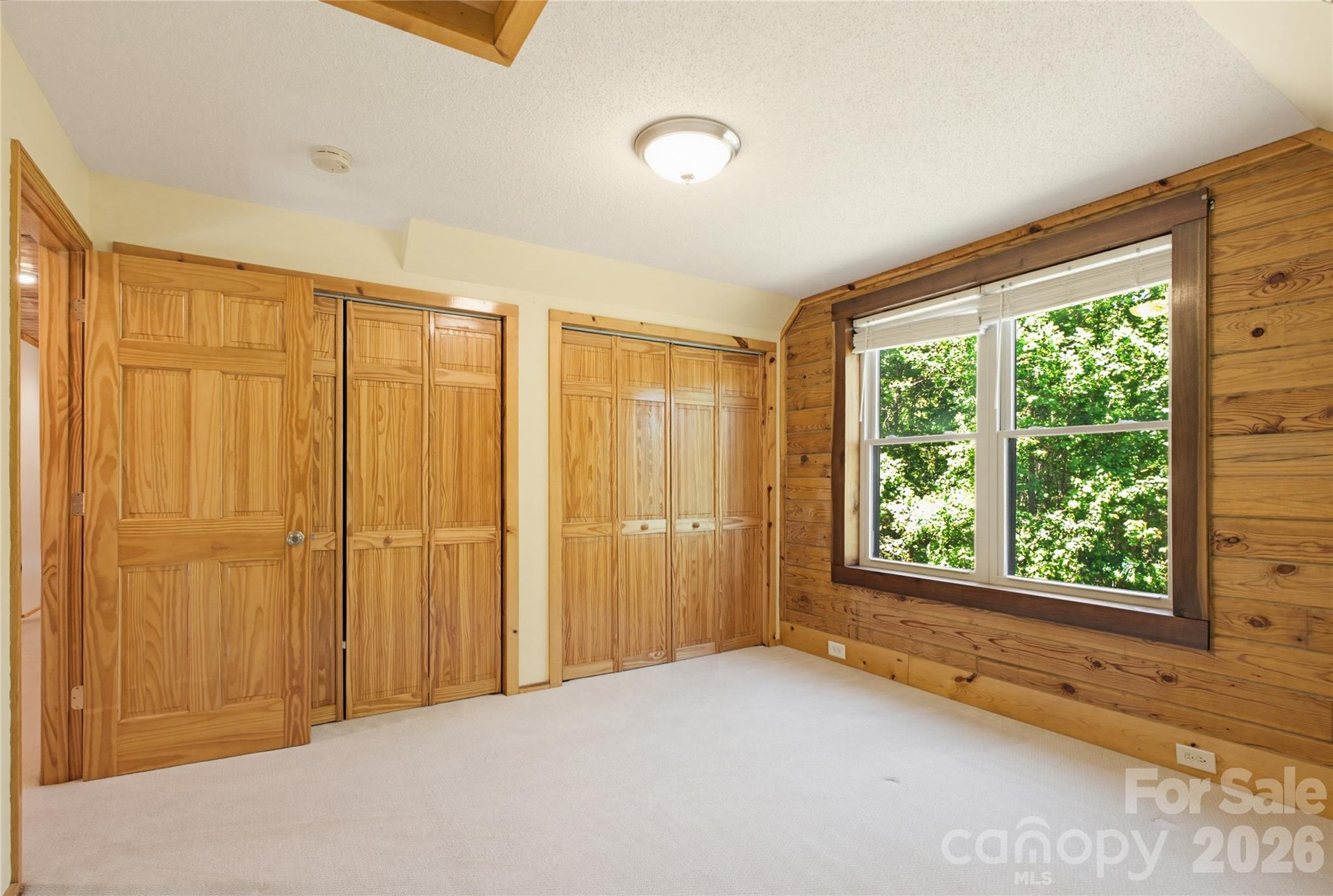 451 Rustic Ridge Drive Canton, NC 28716 - Photo 24 of 44 a view of an empty room with a window