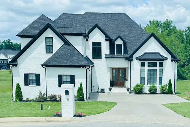 a front view of a house with a yard