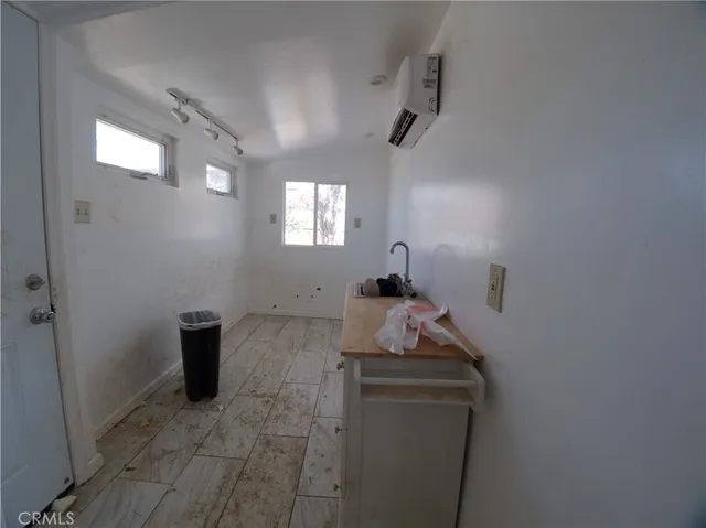 a room with furniture and window