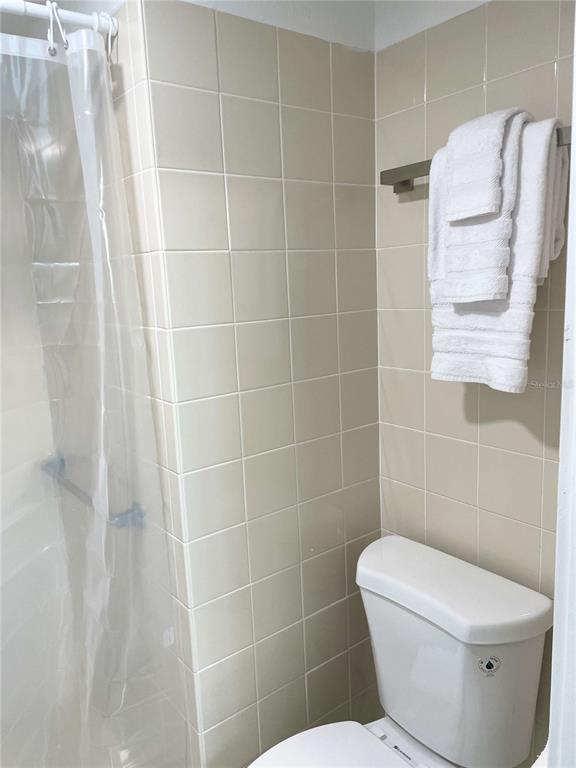 16102 1st Street East Redington Beach, FL 33708 - Photo 25 of 39 a white toilet sitting next to a bathroom sink