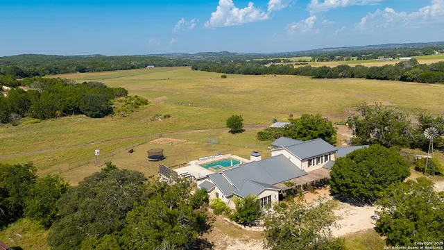a view of a house with swimming pool
