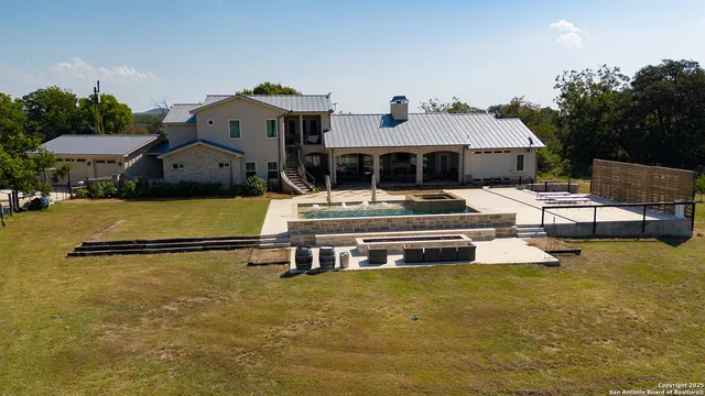 a view of a house with snow on the background