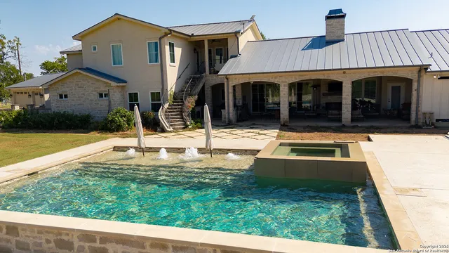 a large kitchen with a table and chairs