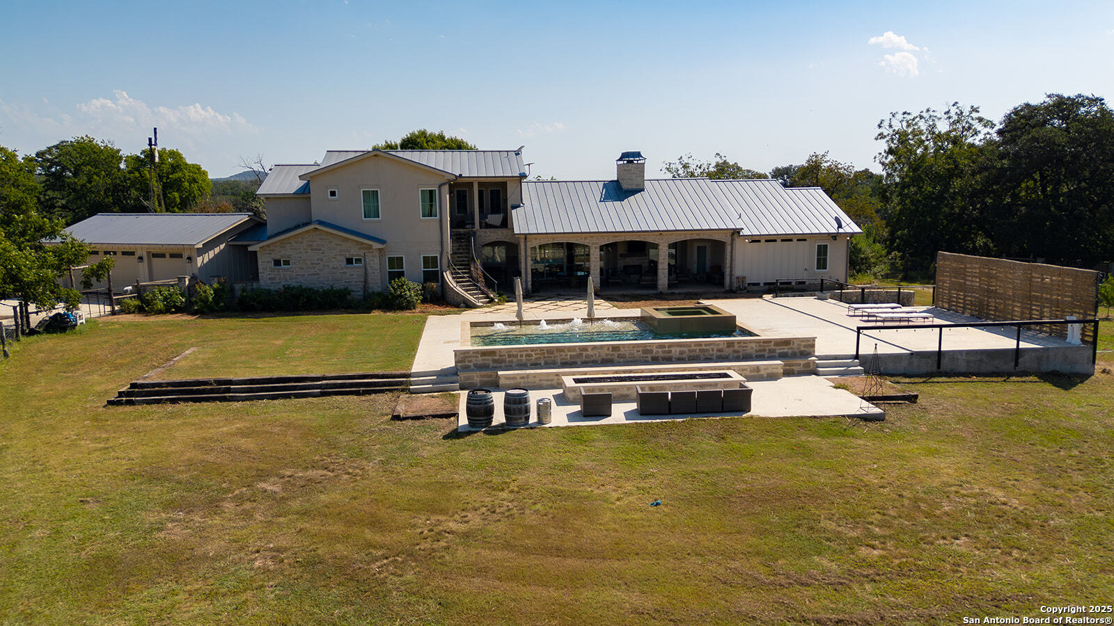 3067 Ranch Road 1888 Blanco, TX 78606 - Photo 18 of 59 a front view of a house with swimming pool