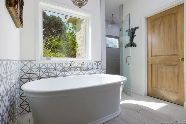 an aerial view of houses covered in trees