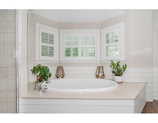 1 Woodridge Road Wellesley, MA 02482 - Photo 17 of 26 a bathroom with a sink a bathtub and a window