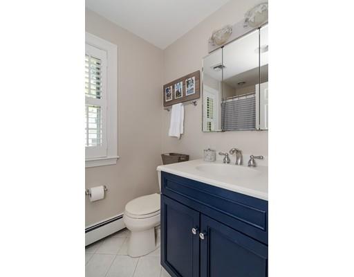 1 Woodridge Road Wellesley, MA 02482 - Photo 21 of 26 a bathroom with a toilet a sink and mirror