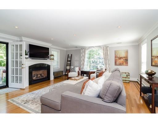 1 Woodridge Road Wellesley, MA 02482 - Photo 8 of 26 a living room with furniture a fireplace and a flat screen tv