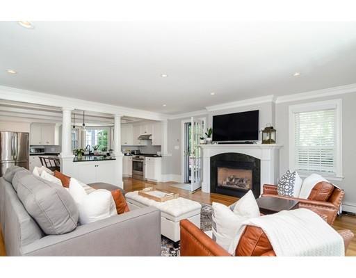 1 Woodridge Road Wellesley, MA 02482 - Photo 9 of 26 a living room with furniture a flat screen tv and a fireplace
