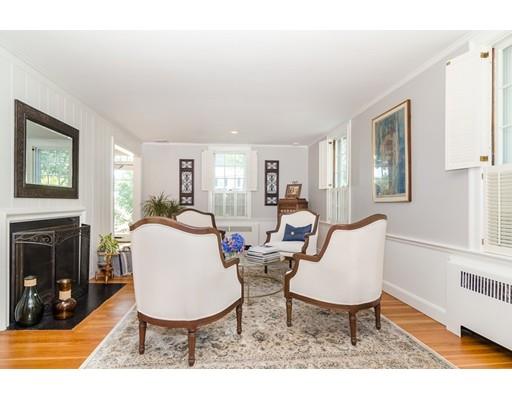 1 Woodridge Road Wellesley, MA 02482 - Photo 10 of 26 a living room with furniture a fireplace and a table with wooden floor