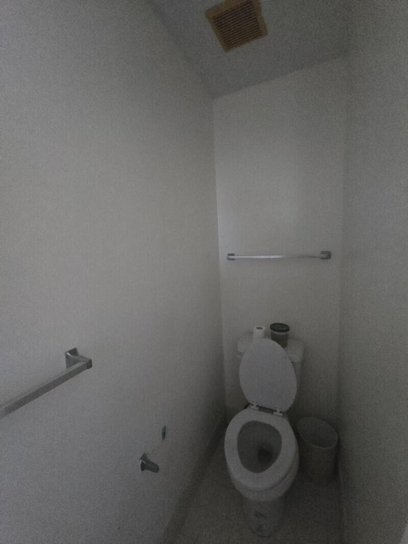 6511 Sandy Bank Terrace Riviera Beach, FL 33407 - Photo 8 of 12 a bathroom with a toilet and a sink