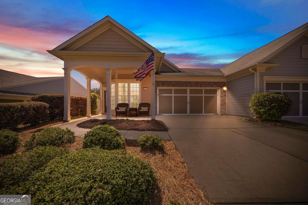1320 Summer Hollow Road Greensboro, GA 30642 - Photo 1 of 45 a front view of a house with garden