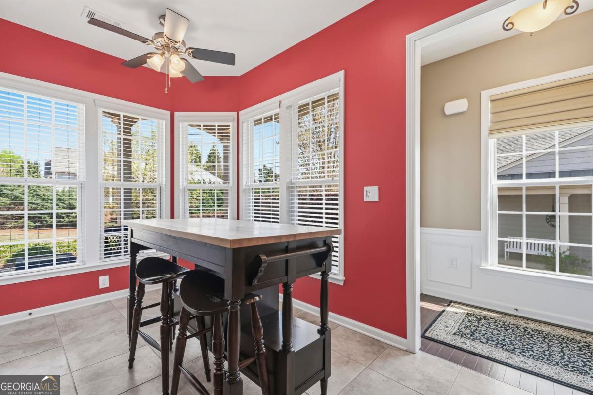 1320 Summer Hollow Road Greensboro, GA 30642 - Photo 12 of 45 a dining room with wooden floor and chandelier