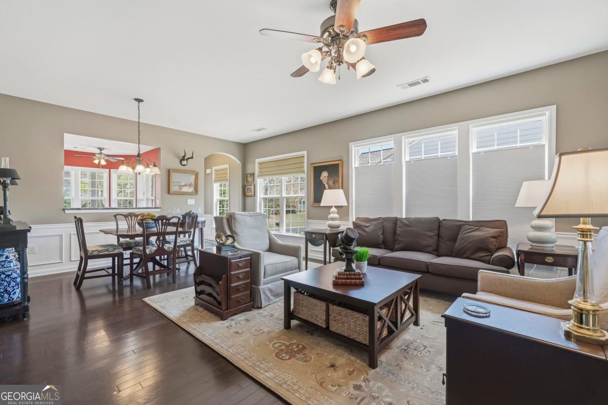 1320 Summer Hollow Road Greensboro, GA 30642 - Photo 19 of 45 a living room with furniture a chandelier and a table