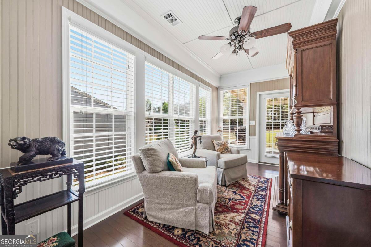 1320 Summer Hollow Road Greensboro, GA 30642 - Photo 23 of 45 a living room with furniture and a floor to ceiling window