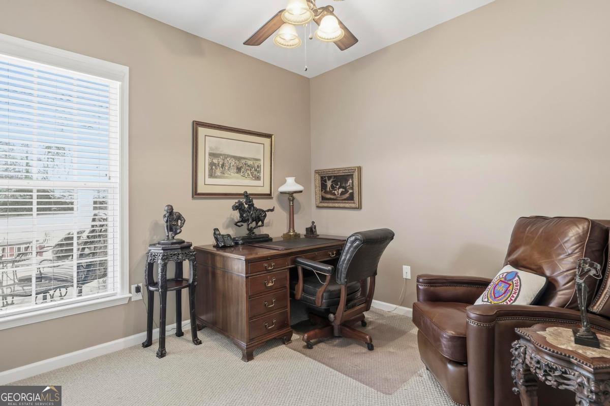 1320 Summer Hollow Road Greensboro, GA 30642 - Photo 26 of 45 a view of a workspace with furniture and a window
