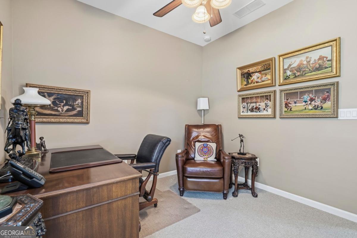 1320 Summer Hollow Road Greensboro, GA 30642 - Photo 27 of 45 a living room with furniture and a window