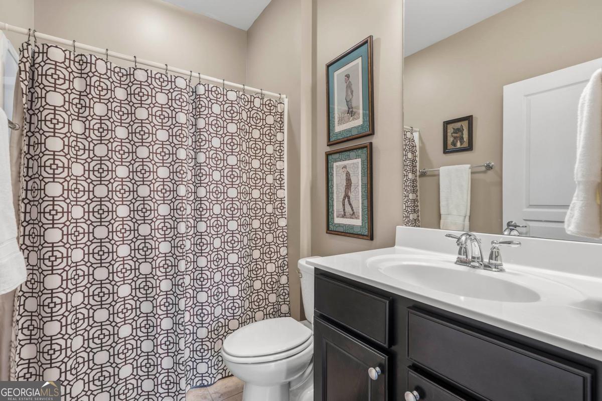 1320 Summer Hollow Road Greensboro, GA 30642 - Photo 28 of 45 a bathroom with a sink toilet and a mirror