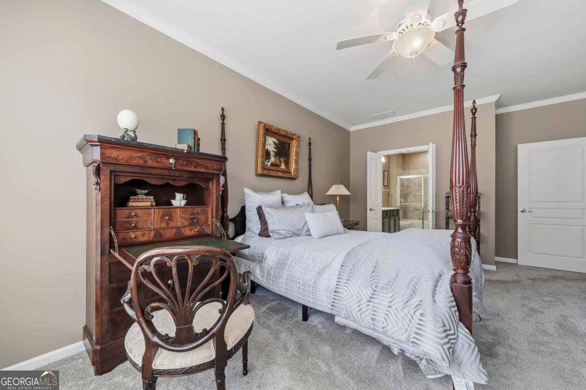 1320 Summer Hollow Road Greensboro, GA 30642 - Photo 30 of 45 a bedroom with a bed and wooden floor