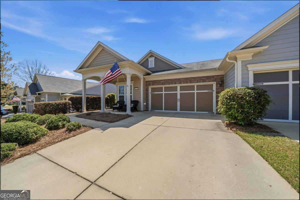 1320 Summer Hollow Road Greensboro, GA 30642 - Photo 3 of 45 a front view of a house with a yard and garage