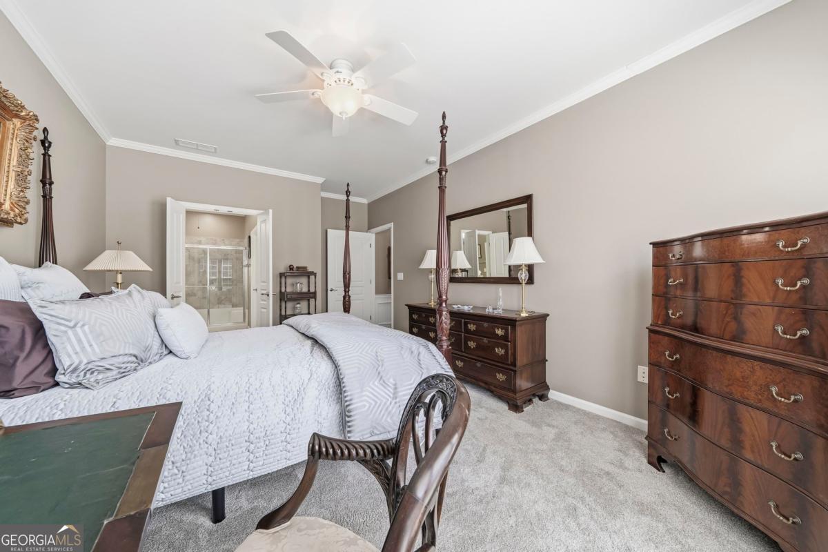 1320 Summer Hollow Road Greensboro, GA 30642 - Photo 31 of 45 a bedroom with a bed and a dresser