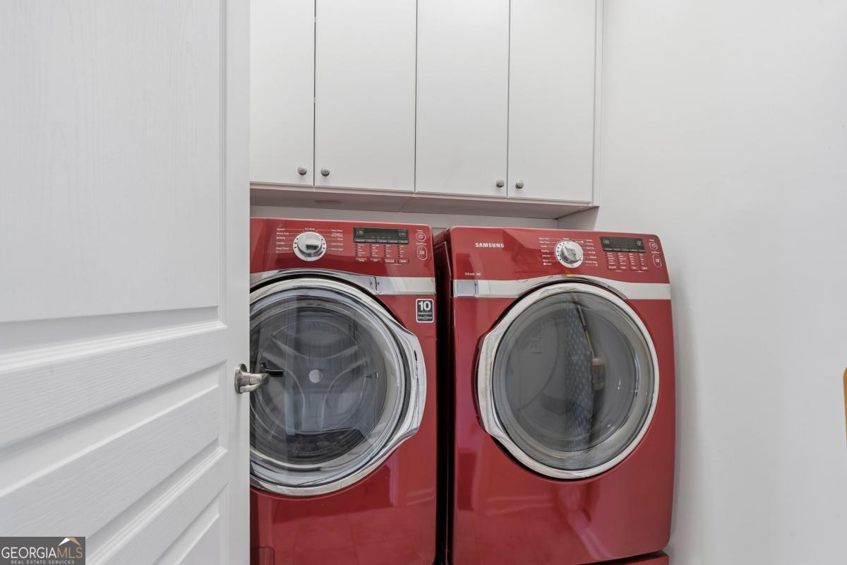 1320 Summer Hollow Road Greensboro, GA 30642 - Photo 34 of 45 a utility room with dryer and washer