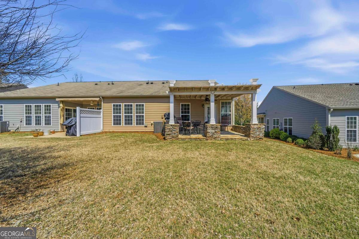 1320 Summer Hollow Road Greensboro, GA 30642 - Photo 36 of 45 a view of a house with a backyard