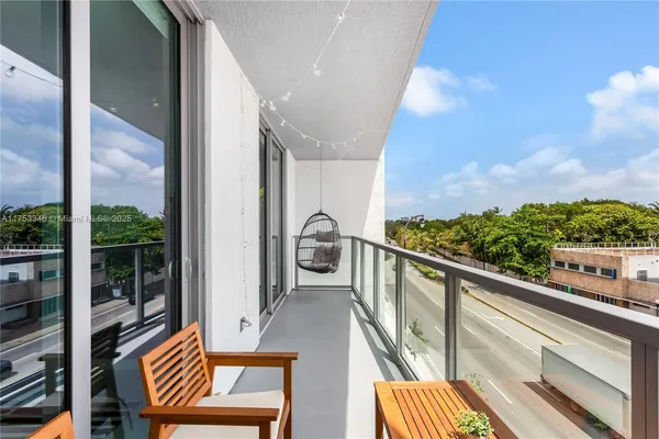 a view of balcony with furniture