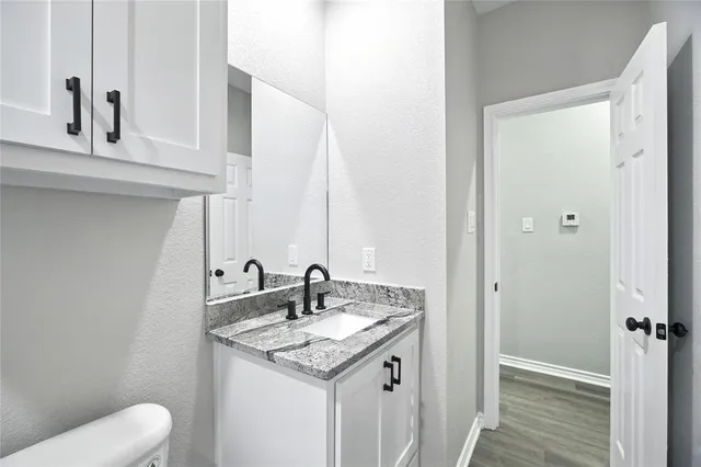 a bathroom with a sink and toilet