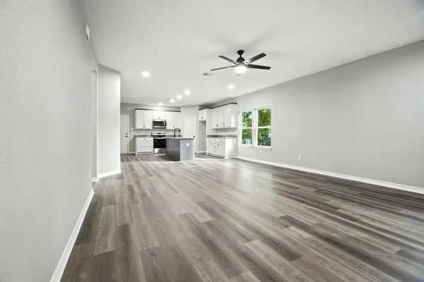 a view of a kitchen with a sink cabinets and a window