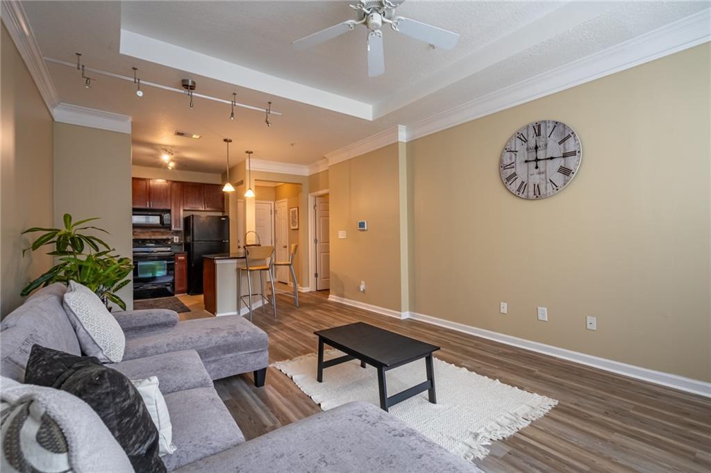 400 17th Street Northwest, Unit 1453 Atlanta, GA 30363 - Photo 12 of 27 a living room with furniture and kitchen view