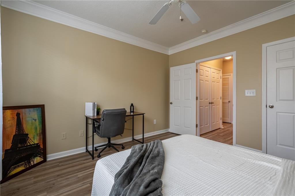 400 17th Street Northwest, Unit 1453 Atlanta, GA 30363 - Photo 17 of 27 a bedroom with a bed and a mirror