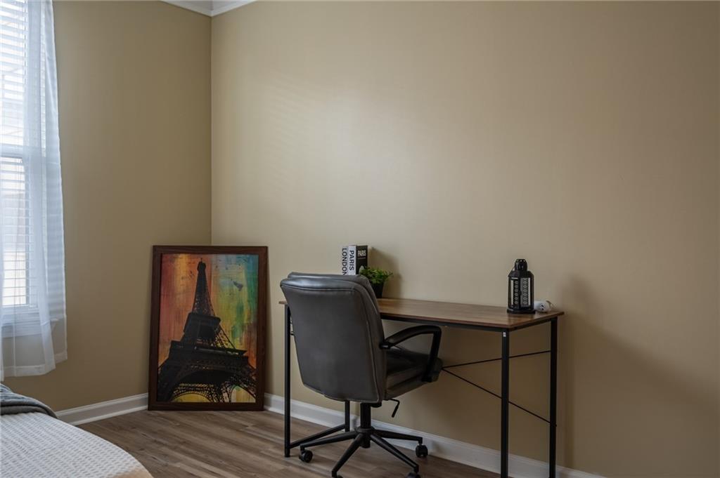 400 17th Street Northwest, Unit 1453 Atlanta, GA 30363 - Photo 18 of 27 a view of a workspace with furniture and wooden floor