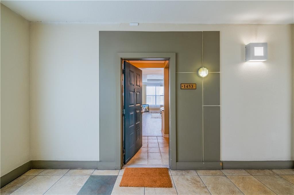 400 17th Street Northwest, Unit 1453 Atlanta, GA 30363 - Photo 23 of 27 a view of a hallway with wooden floor and a livingroom