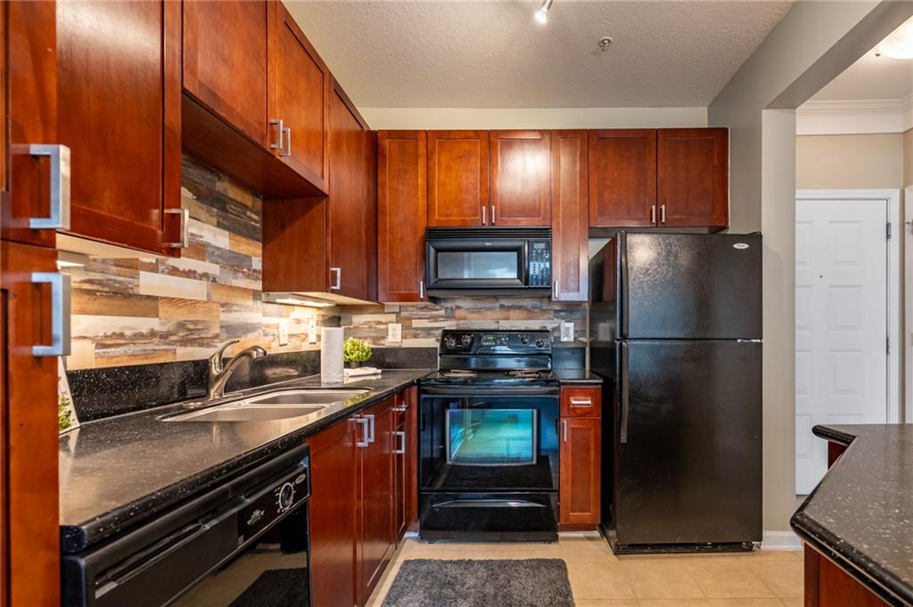 400 17th Street Northwest, Unit 1453 Atlanta, GA 30363 - Photo 3 of 27 a kitchen with a refrigerator stove and sink