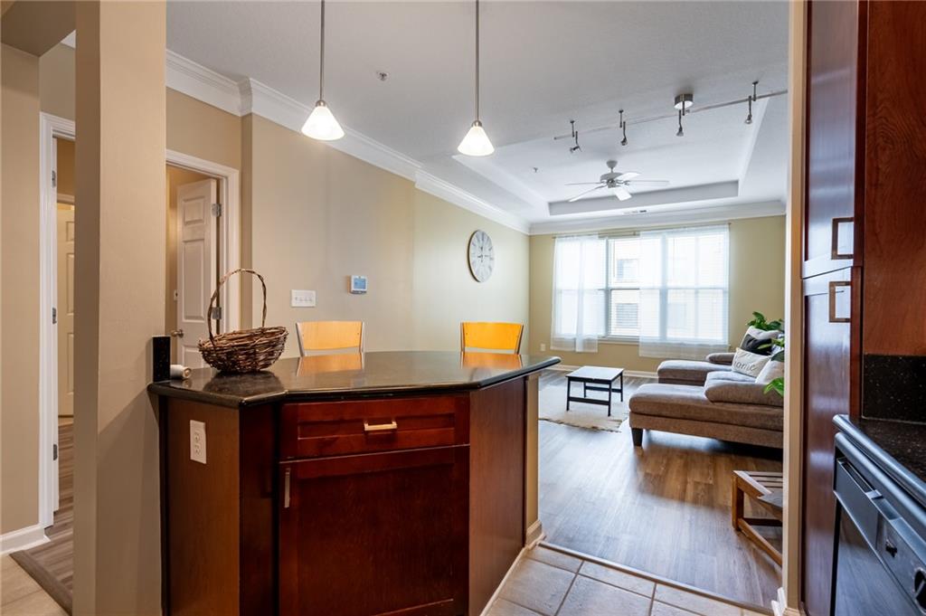 400 17th Street Northwest, Unit 1453 Atlanta, GA 30363 - Photo 6 of 27 a kitchen with granite countertop a sink counter top space and living room view