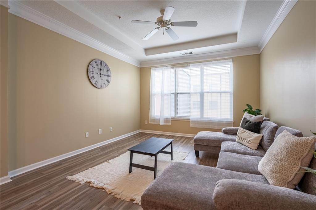 400 17th Street Northwest, Unit 1453 Atlanta, GA 30363 - Photo 8 of 27 a living room with furniture and a window