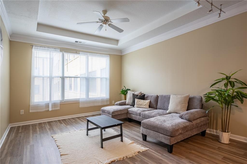 400 17th Street Northwest, Unit 1453 Atlanta, GA 30363 - Photo 9 of 27 a living room with furniture and a large window