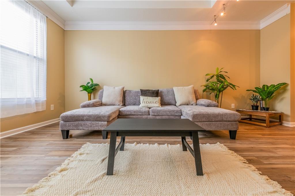 400 17th Street Northwest, Unit 1453 Atlanta, GA 30363 - Photo 10 of 27 a living room with furniture and wooden floor