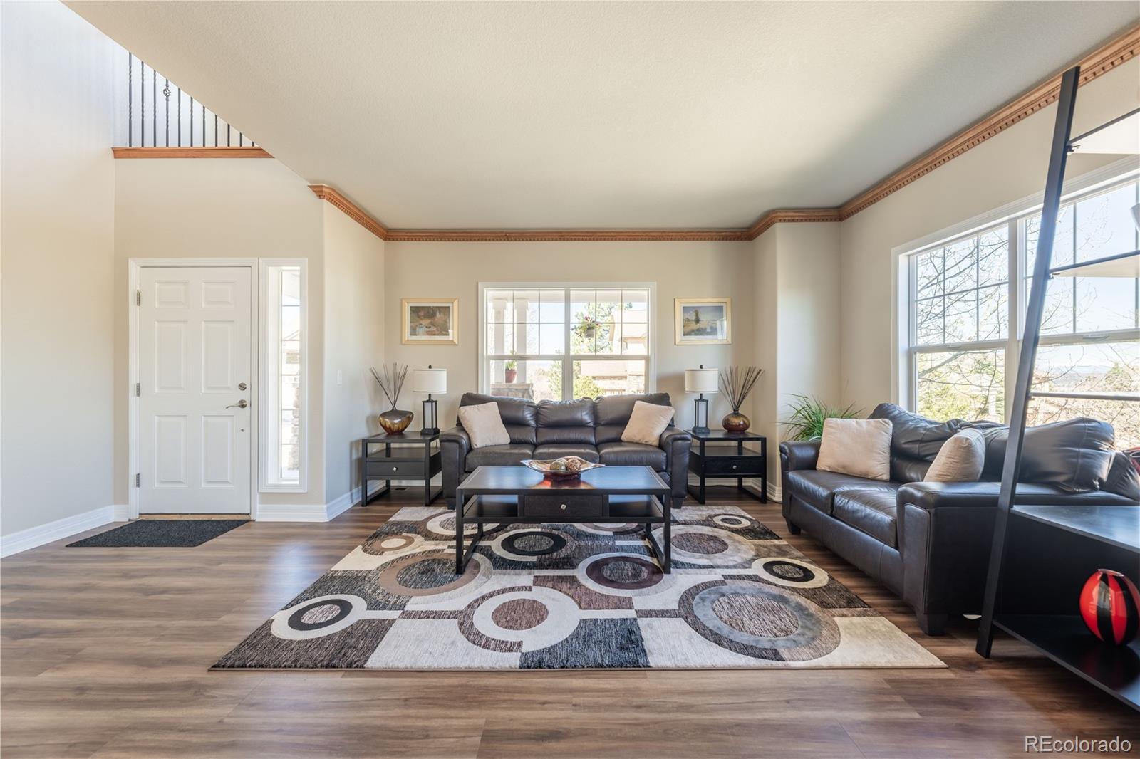 1610 Ridgetrail Court Castle Rock, CO 80104 - Photo 11 of 50 a living room with furniture window and wooden floor