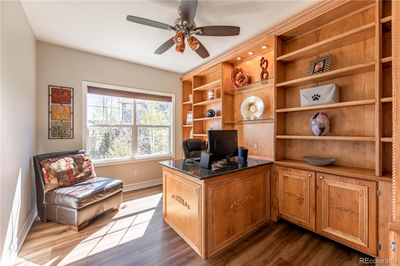1610 Ridgetrail Court Castle Rock, CO 80104 - Photo 13 of 50 a living room with furniture and a flat screen tv