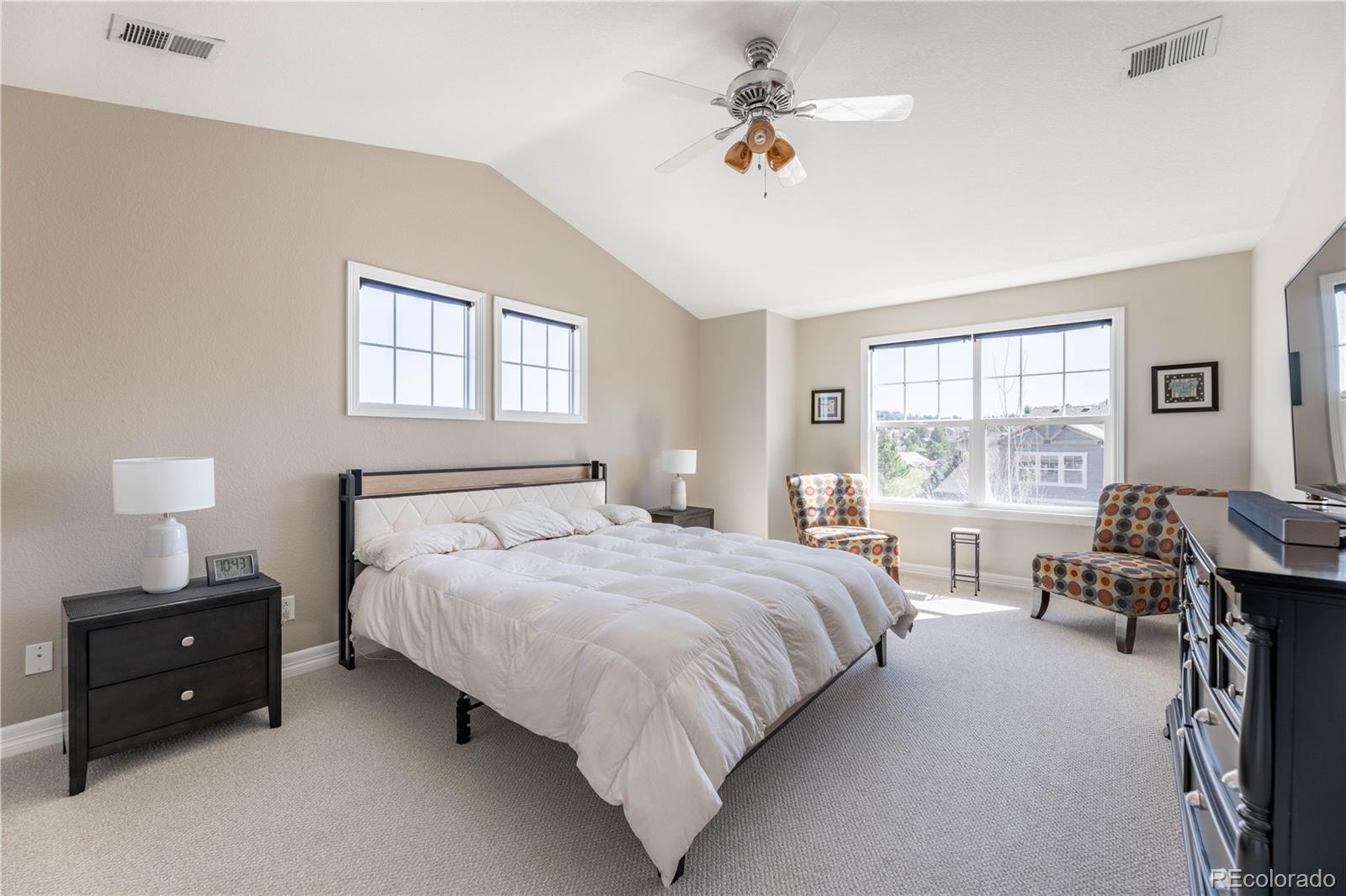 1610 Ridgetrail Court Castle Rock, CO 80104 - Photo 17 of 50 a bedroom with a bed and a table