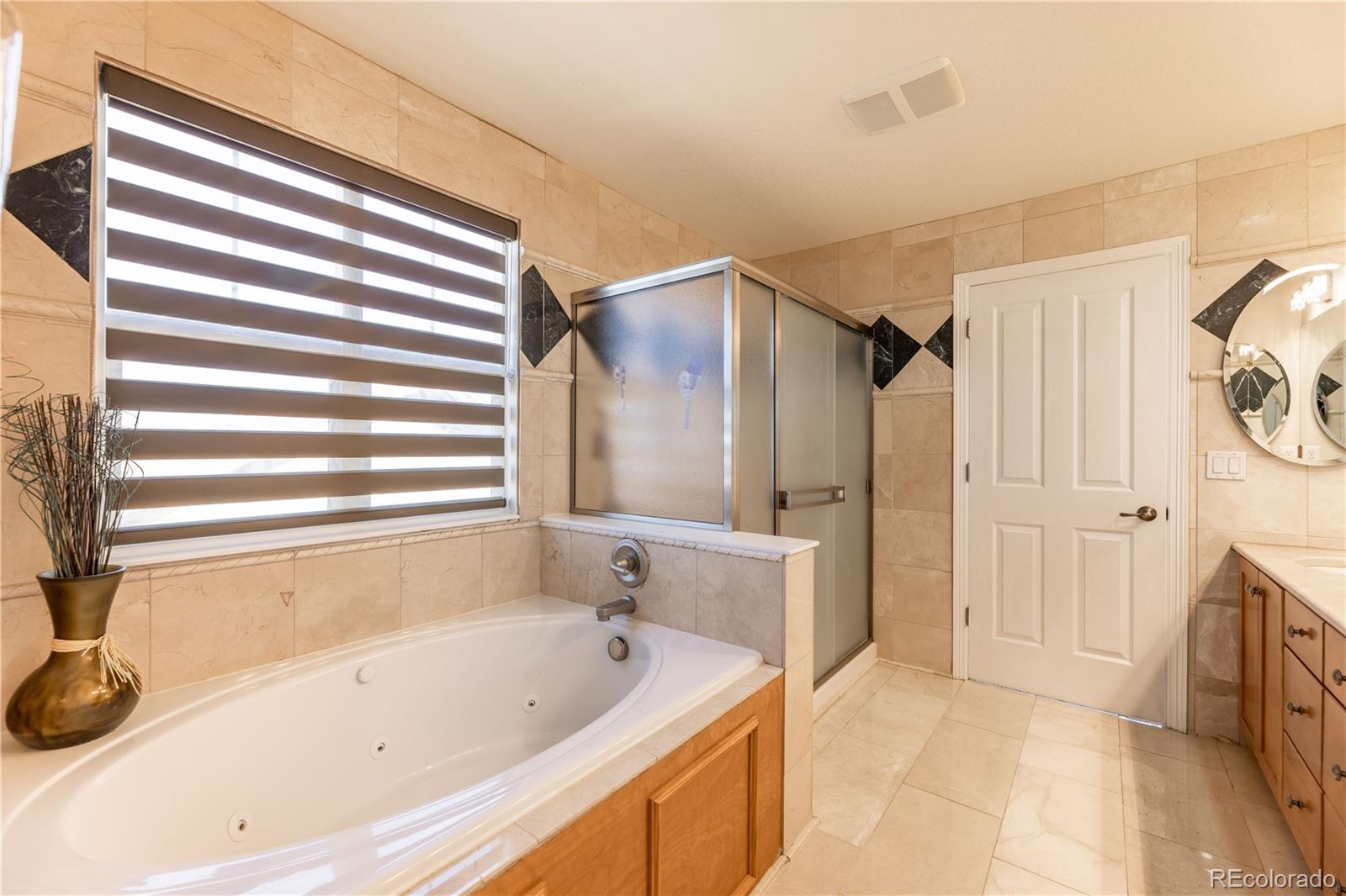 1610 Ridgetrail Court Castle Rock, CO 80104 - Photo 20 of 50 a bathroom with a bathtub and a shower