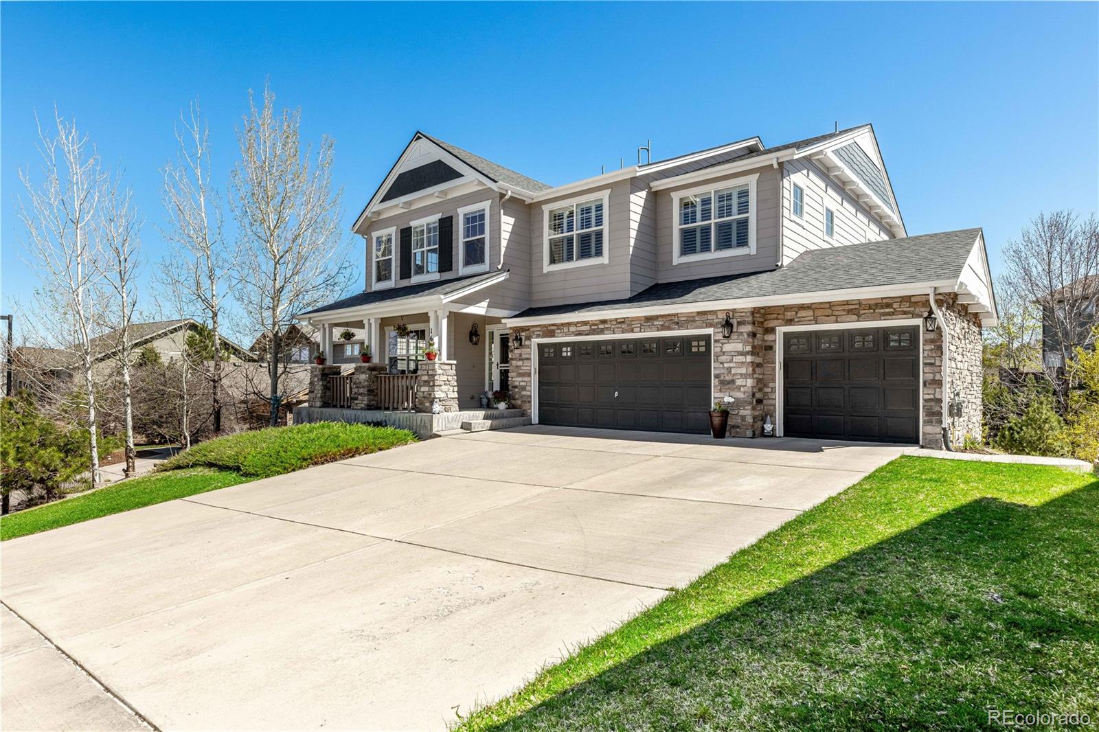 1610 Ridgetrail Court Castle Rock, CO 80104 - Photo 2 of 50 a front view of a house with a yard and garage
