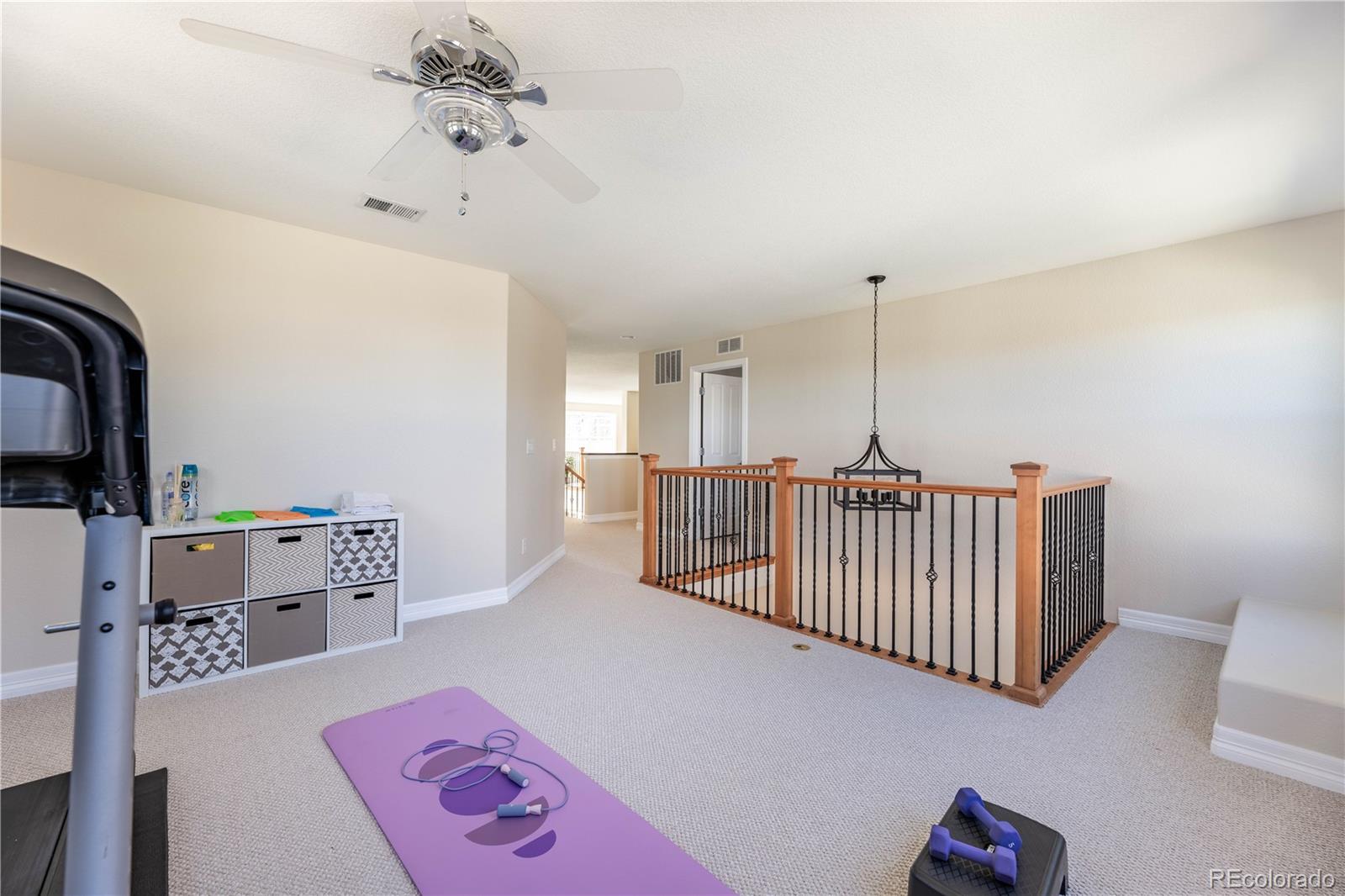 1610 Ridgetrail Court Castle Rock, CO 80104 - Photo 26 of 50 a bedroom with furniture and a window