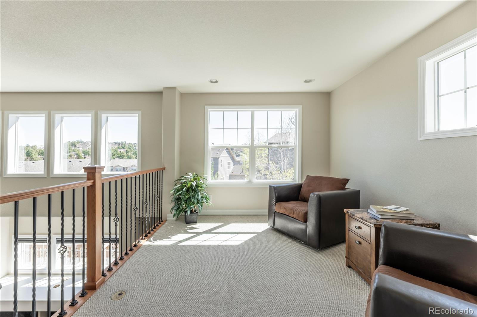 1610 Ridgetrail Court Castle Rock, CO 80104 - Photo 27 of 50 a living room with furniture and windows