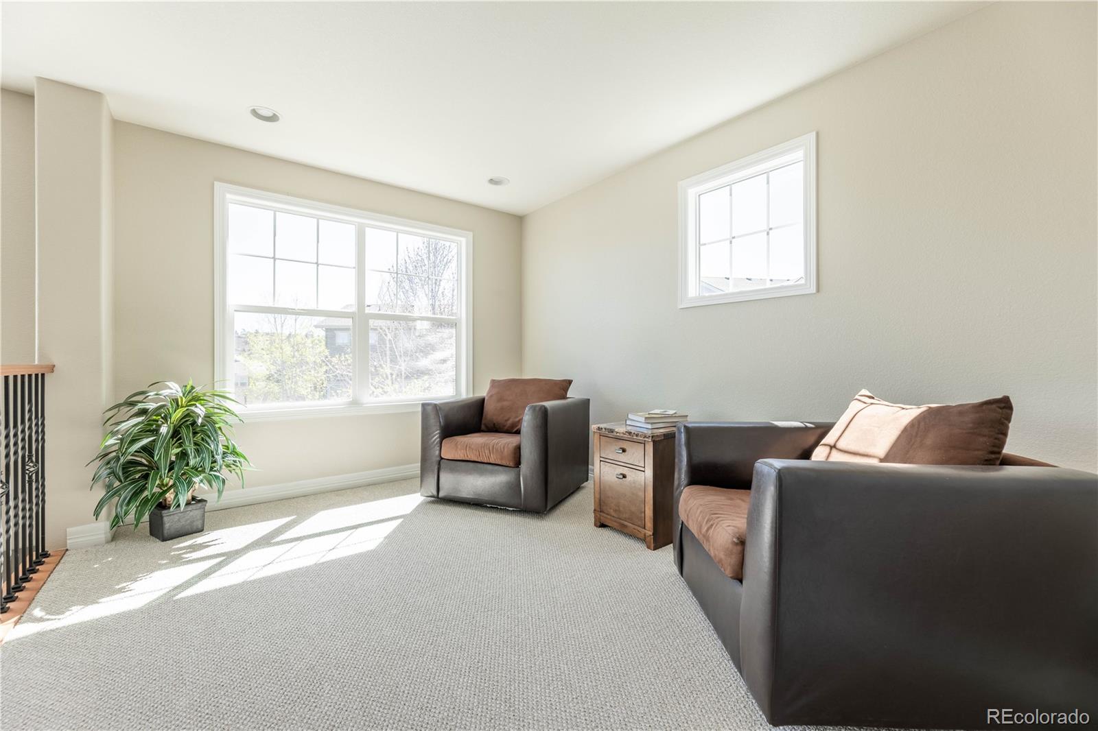 1610 Ridgetrail Court Castle Rock, CO 80104 - Photo 28 of 50 a bedroom with furniture and a window