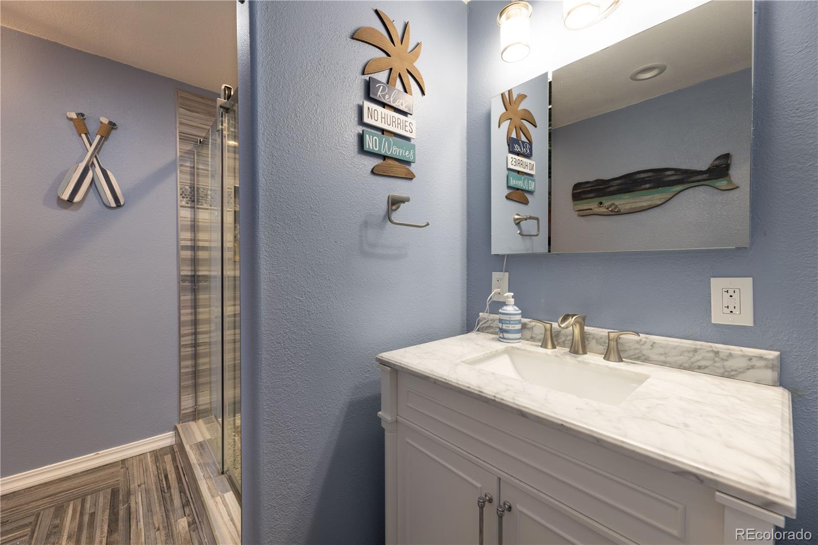 1610 Ridgetrail Court Castle Rock, CO 80104 - Photo 37 of 50 a bathroom with a sink and mirror